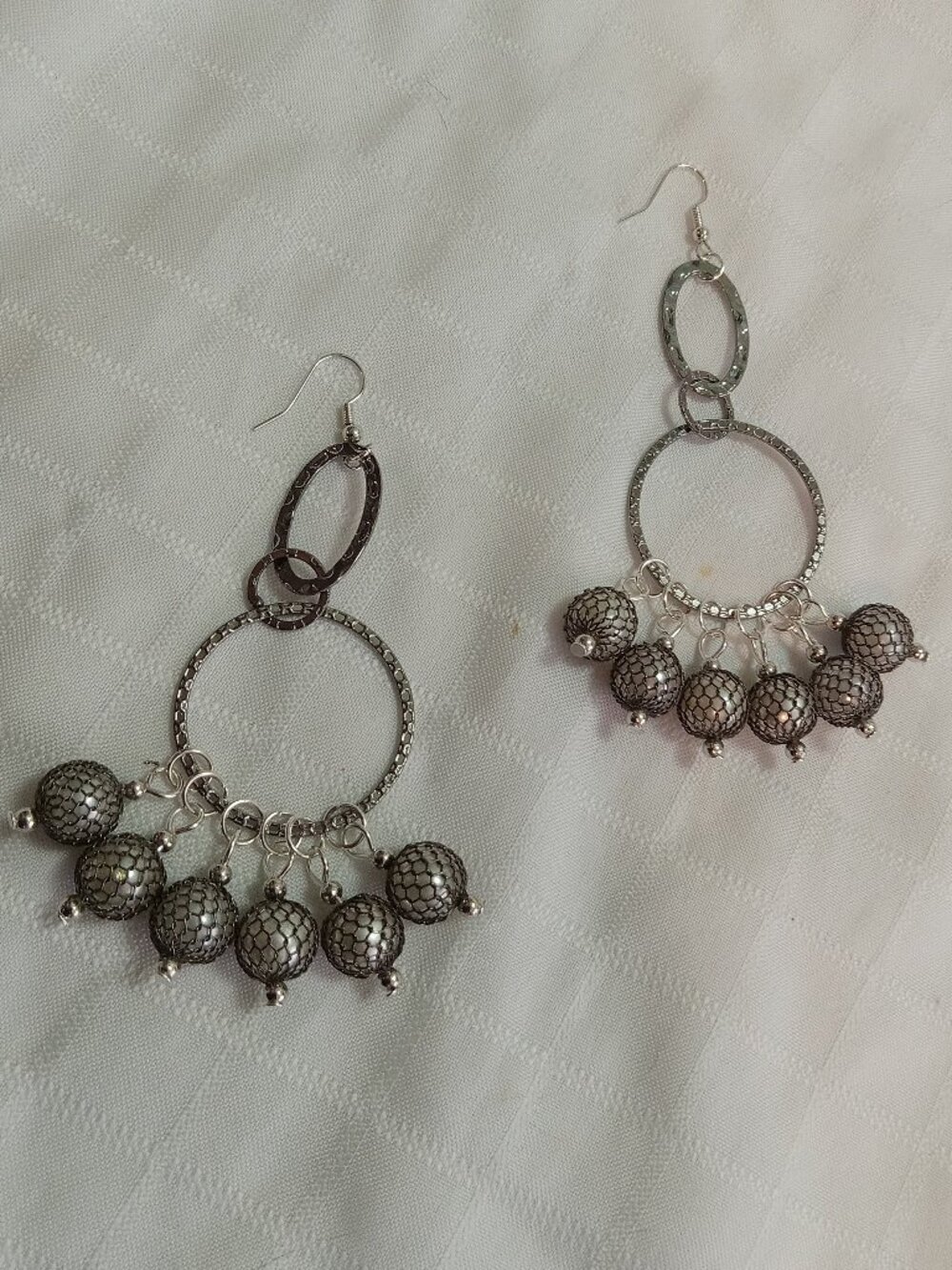 Unique handmade earrings in a silver color